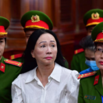 Vietnamese property tycoon Truong My Lan (front row 3rd L) looks on at a court in Ho Chi Minh City on April 11, 2024. A top Vietnamese property tycoon could face the death penalty when she and dozens of other co-accused face verdicts on April 11 in one of the country's biggest fraud cases over the embezzlement of USD 12.5 billion.